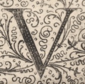 Decorative letter V illustration in vintage manuscript style.