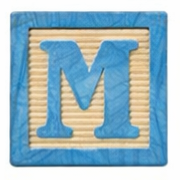 Wooden block with the letter M.